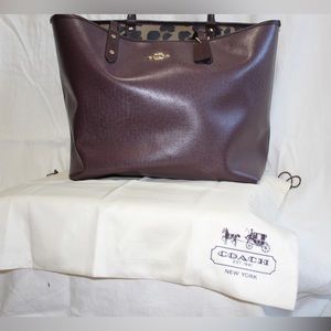 Purple Coach tote with animal print inside